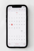 A calendar with a highlighted date and a phone icon indicating a scheduled call.