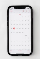 A professional calendar with scheduled appointments highlighted on a sleek digital device