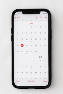 a phone with a calendar on the screen