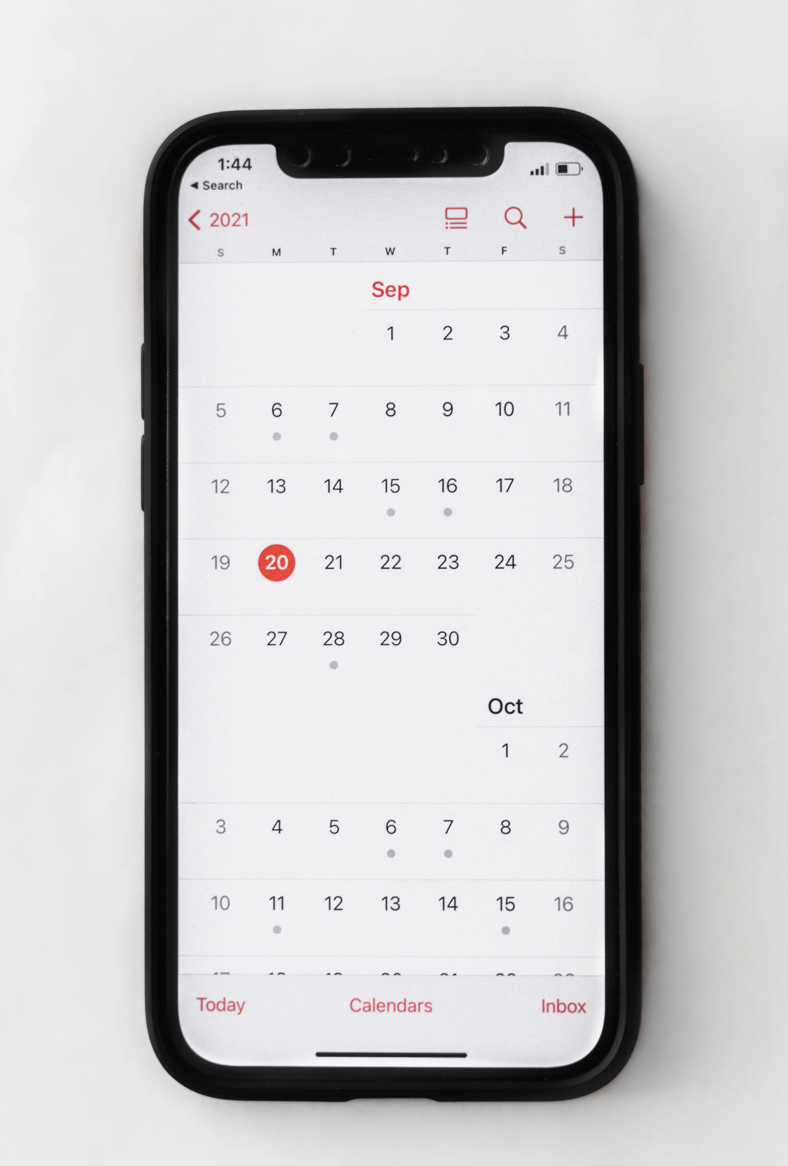 A smartphone showing a monthly calendar