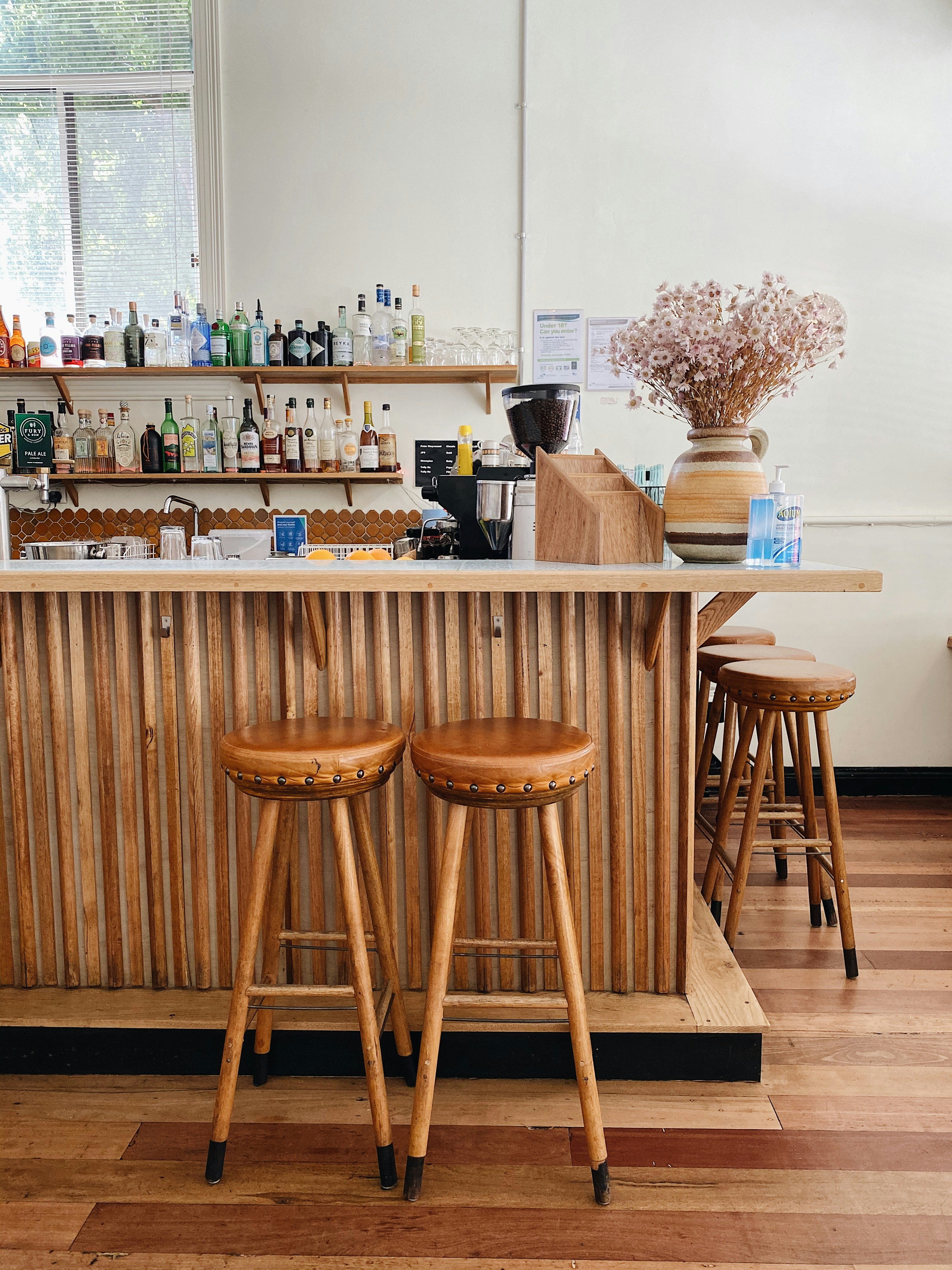 two stools at the bar of a restaurant