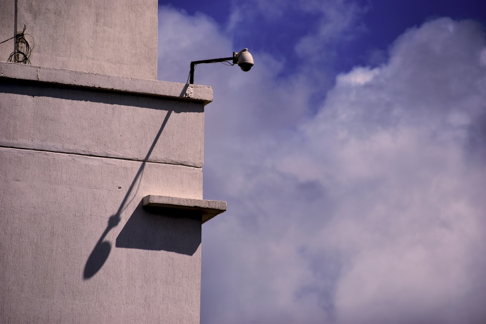 a street light on the side of a building