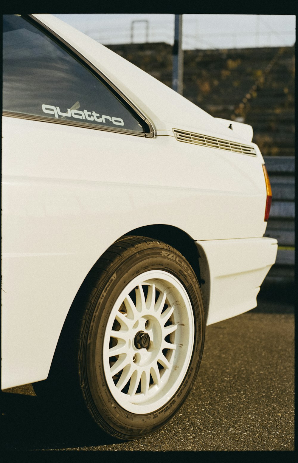 a white car parked in a parking lot