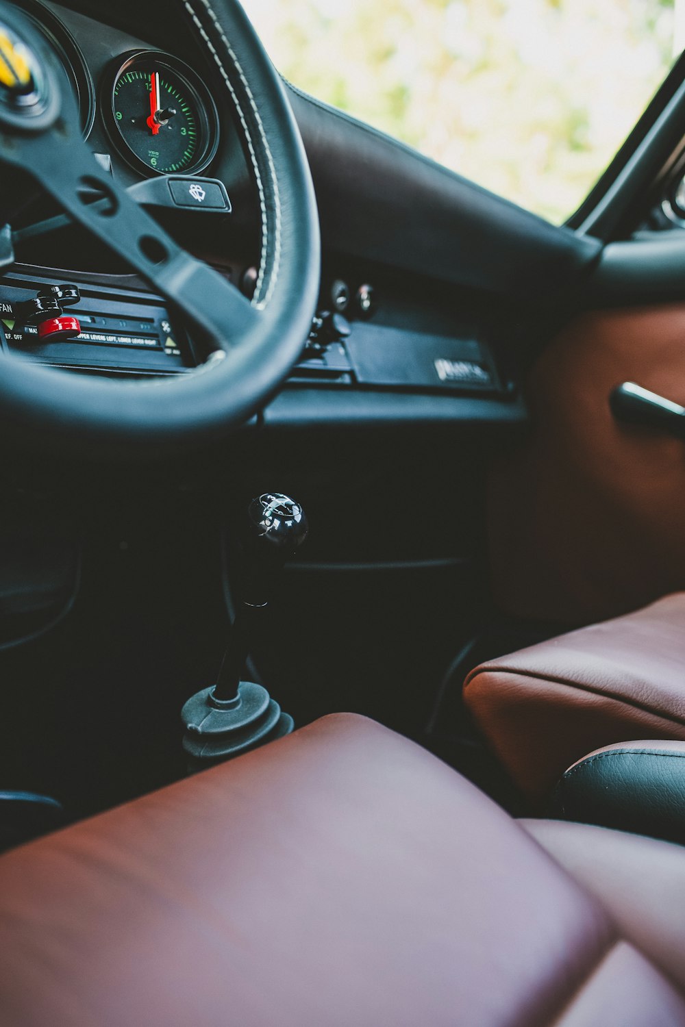 the interior of a car with a steering wheel and dashboard