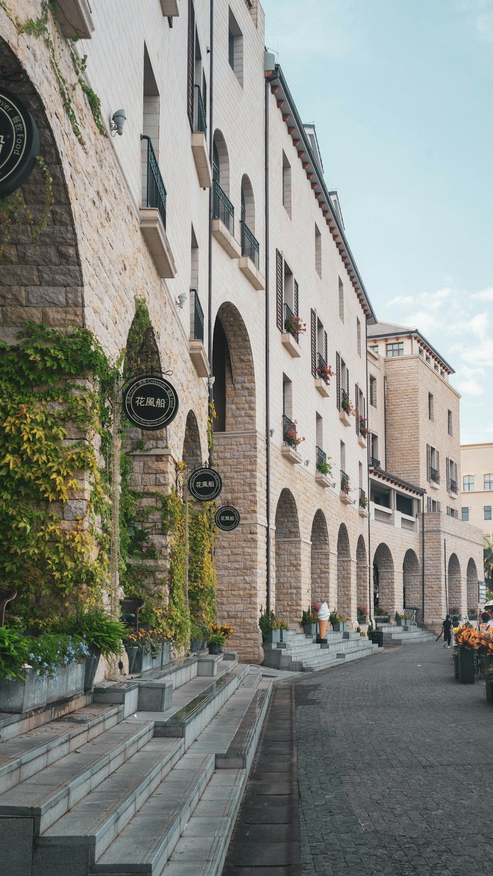 a cobblestone street lined with tall buildings