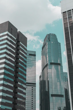 a couple of tall buildings sitting next to each other