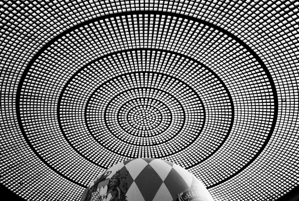 a man is standing in front of a circular structure