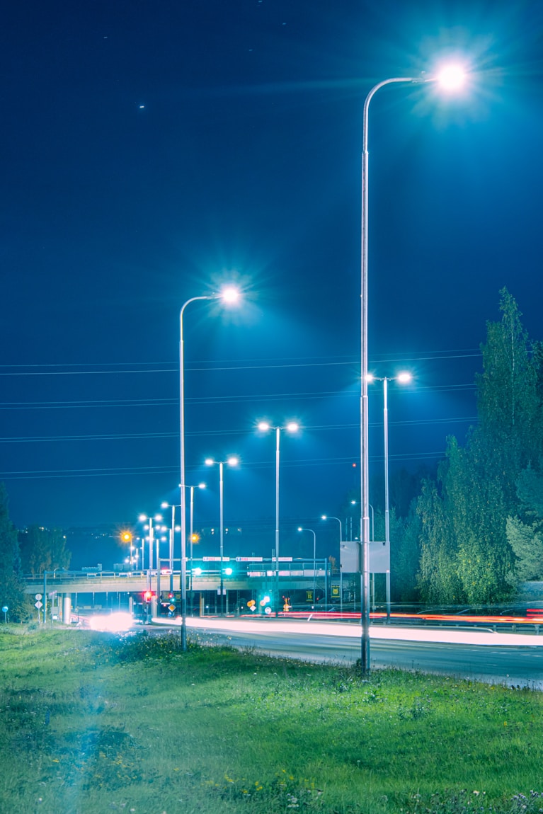 a city street at night with street lights