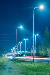 a city street at night with street lights