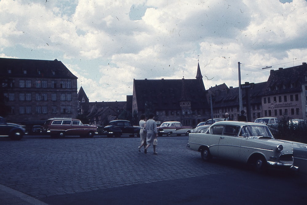 a couple of cars that are sitting in the street