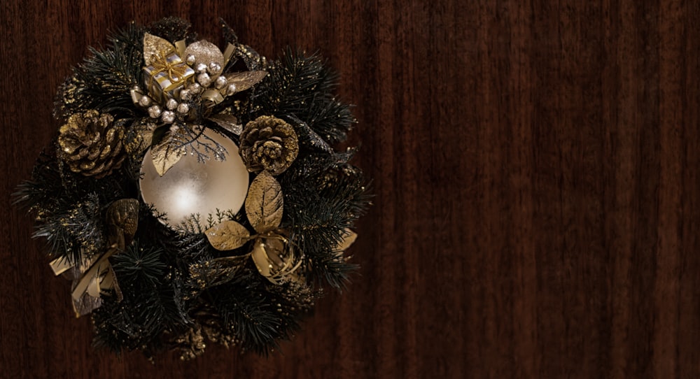 a christmas wreath hanging on a wooden wall