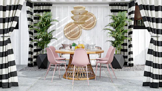a dining room with black and white striped curtains