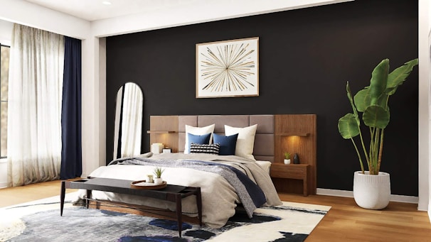 A stylish bedroom with a deep navy blue accent wall and minimalist furniture.