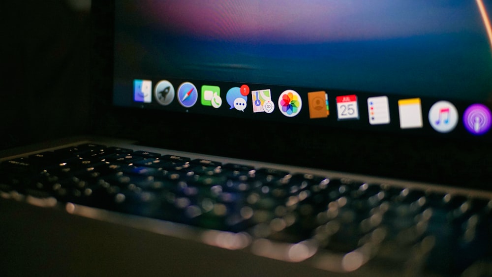 a close up of a laptop computer with icons on the screen