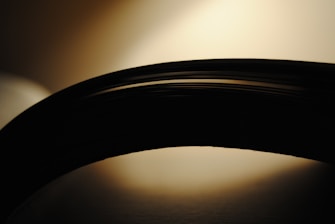 Silicone coated baking paper sheets neatly stacked with a soft warm light