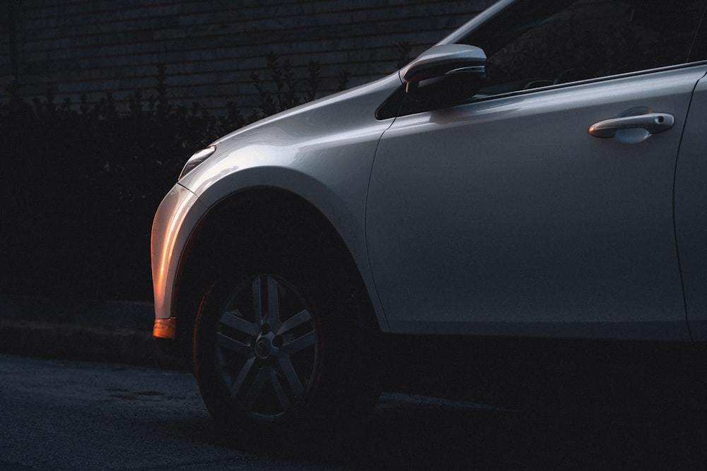 a white car parked on the side of the road