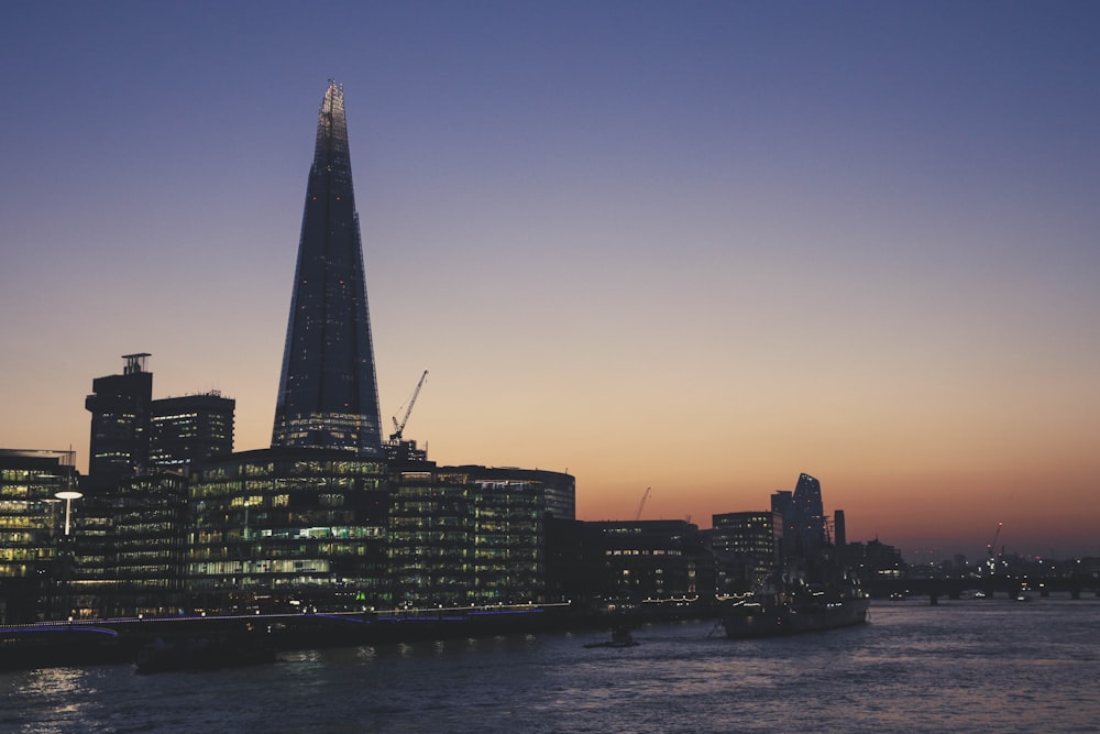 the shard of the building is lit up at night