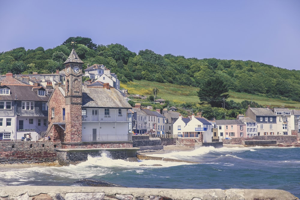 a group of houses next to a body of water