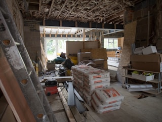 a room filled with lots of boxes and a ladder