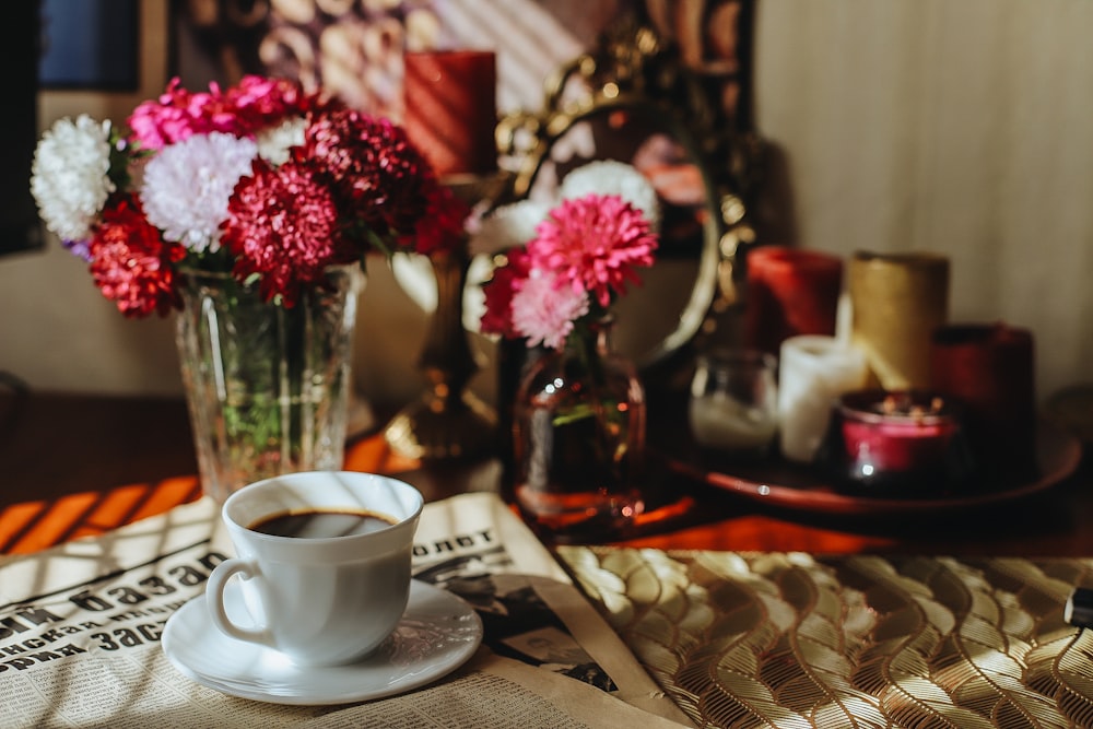 a cup of coffee sitting on top of a table