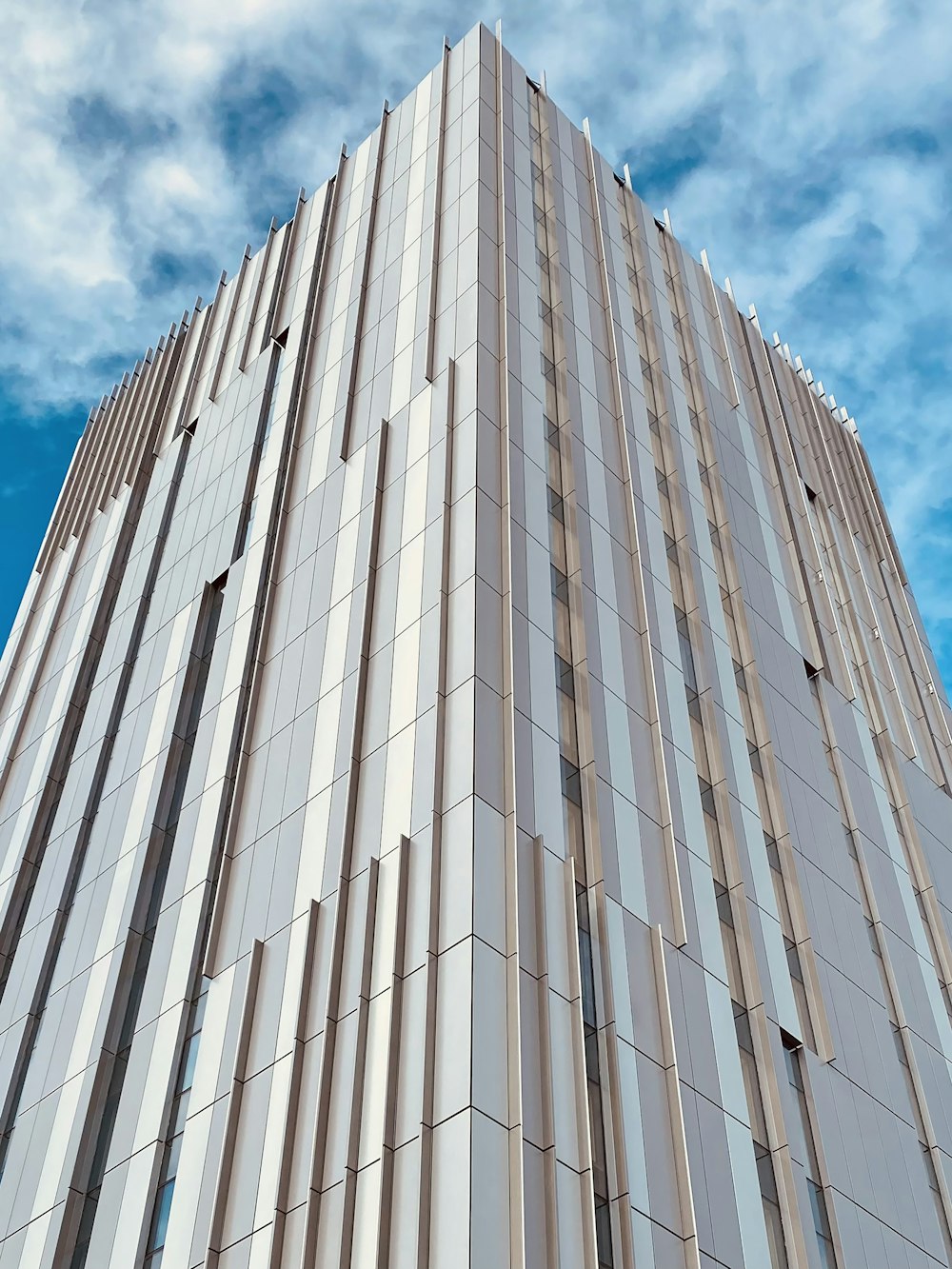 a very tall building with a sky background