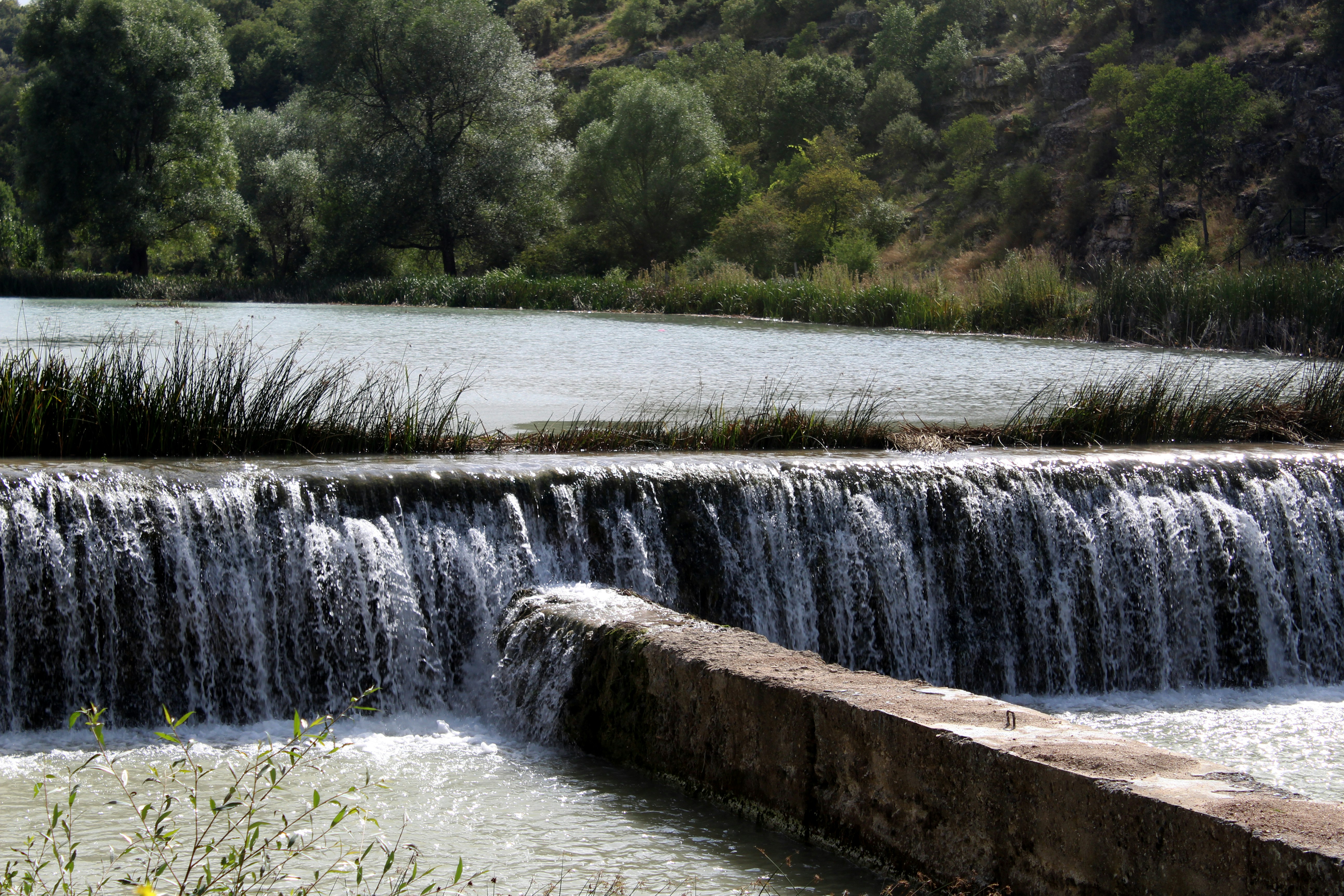 a large waterfall with water running over it