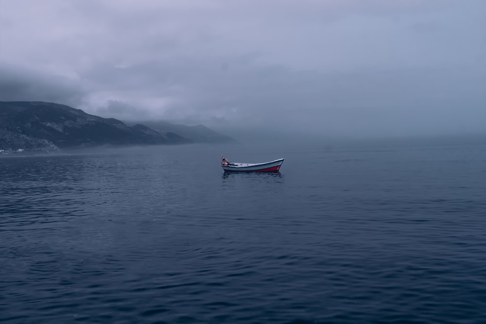 a boat floating on top of a large body of water