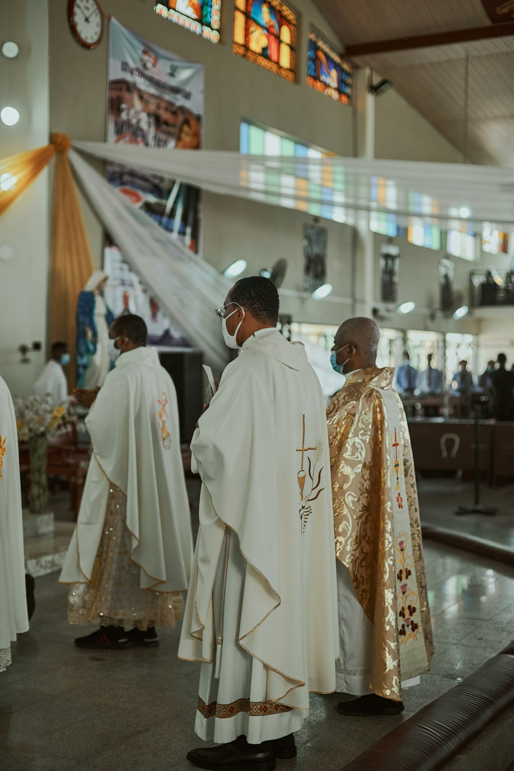 a group of men standing next to each other in a church