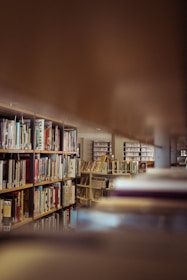 a blurry photo of a library with bookshelves