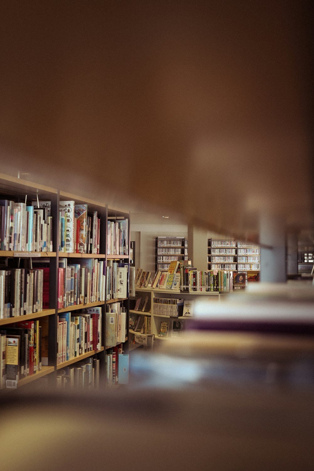 a blurry photo of a library with bookshelves