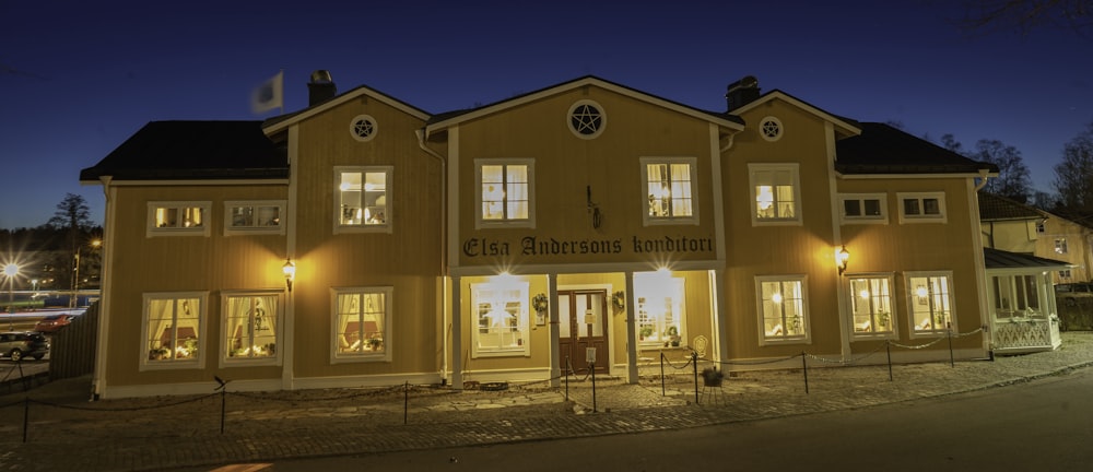 a large yellow building lit up at night