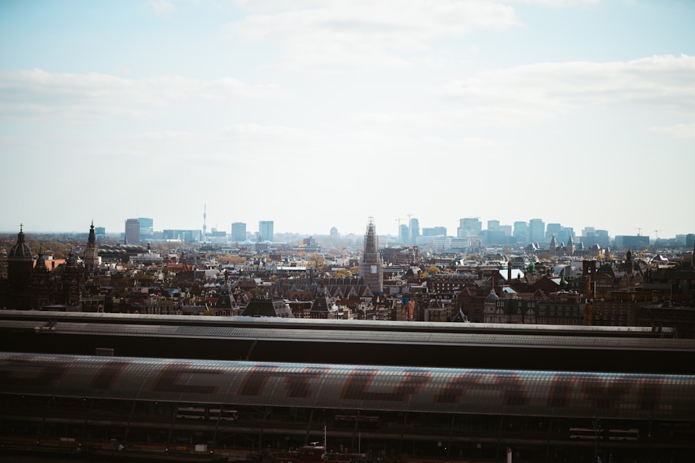 a view of a city with a train passing by