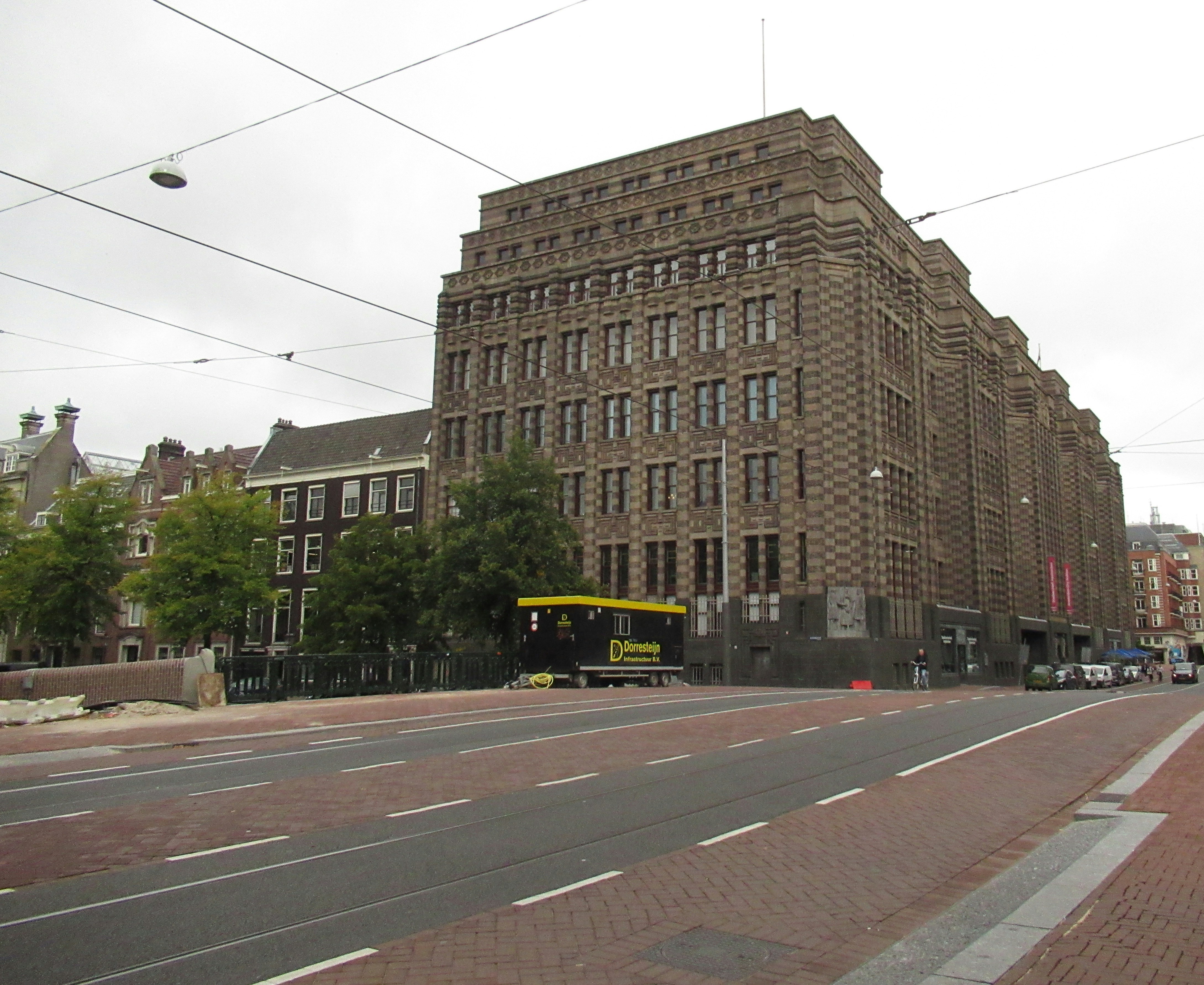 a large brick building sitting on the side of a road