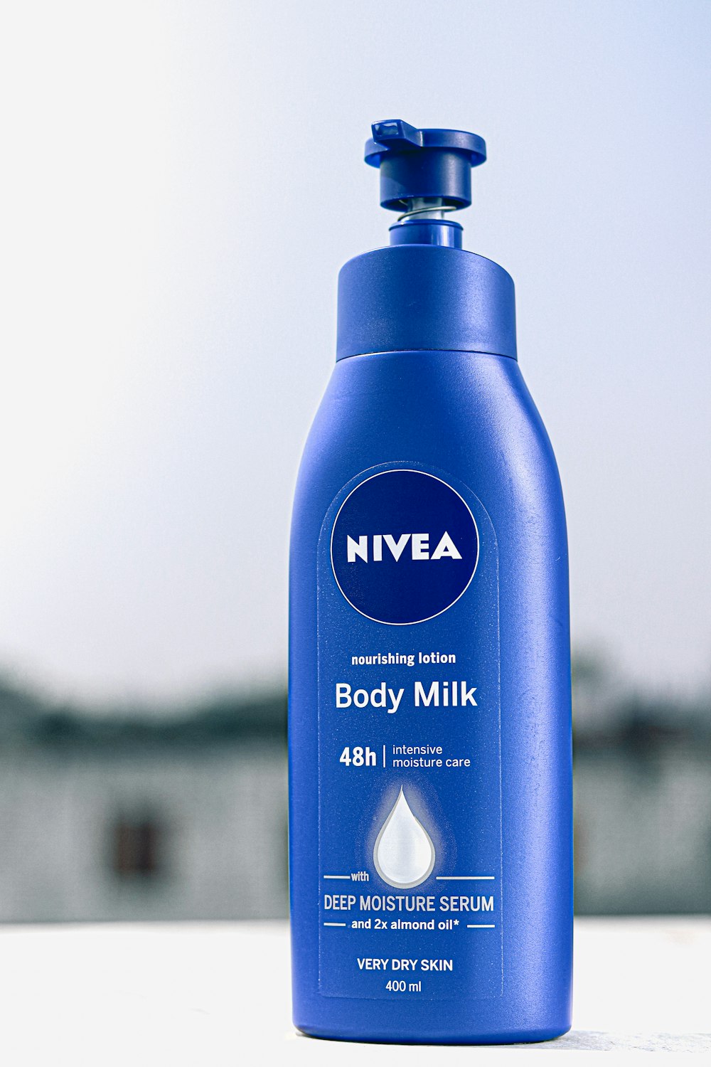 a bottle of nivea body milk sitting on a table