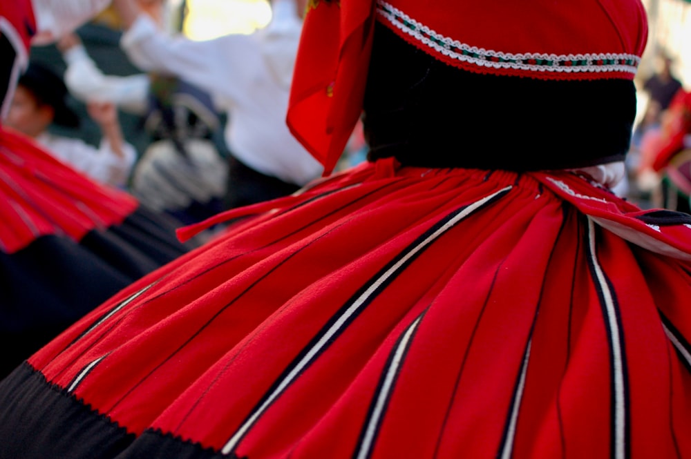 a woman in a red and black dress