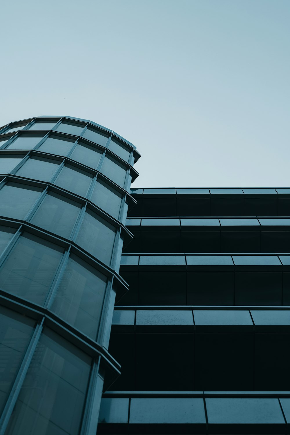 a tall building with a sky in the background