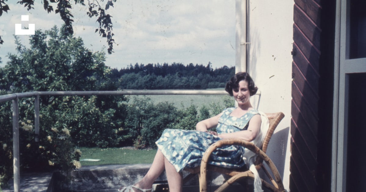 A woman sitting in a chair on a porch photo Free Grey Image on Unsplash A woman sitting in a chair on a porch photo Free Grey Image on Unsplash
