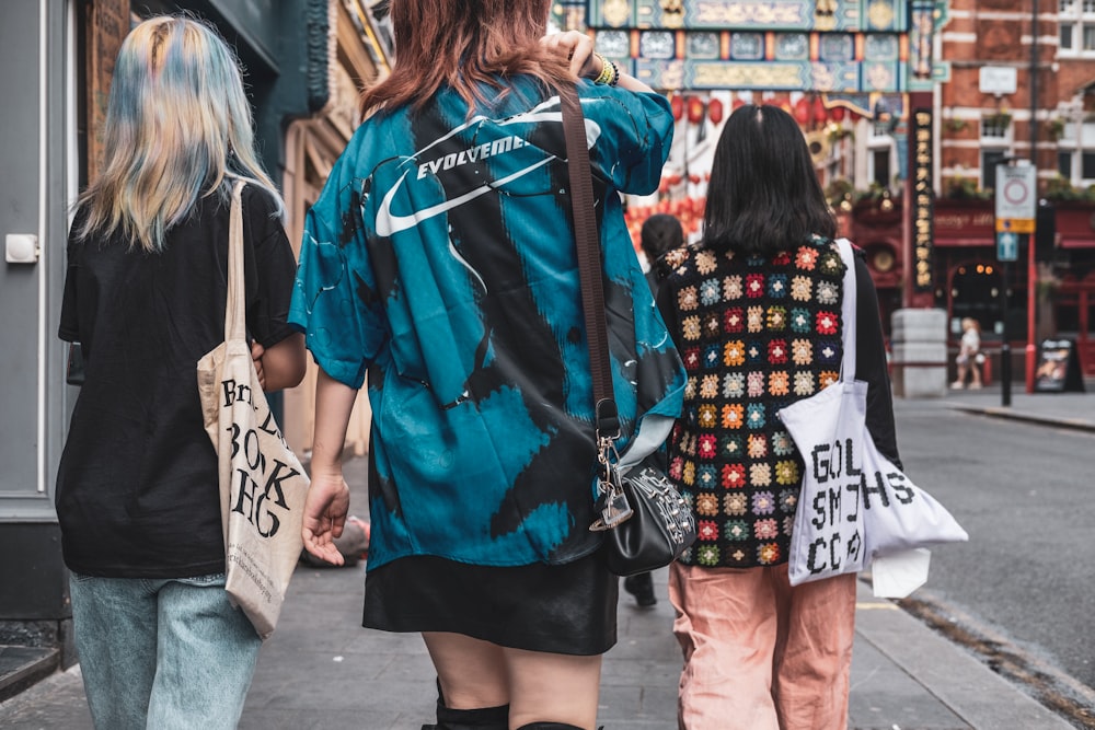 a group of people walking down a street