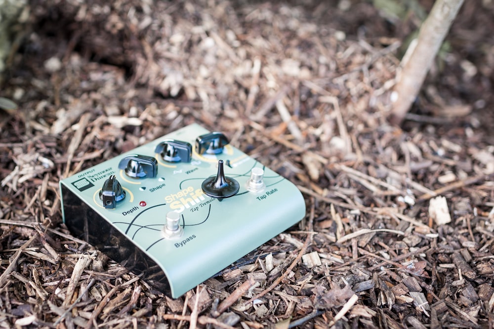 a close up of an electronic device on the ground