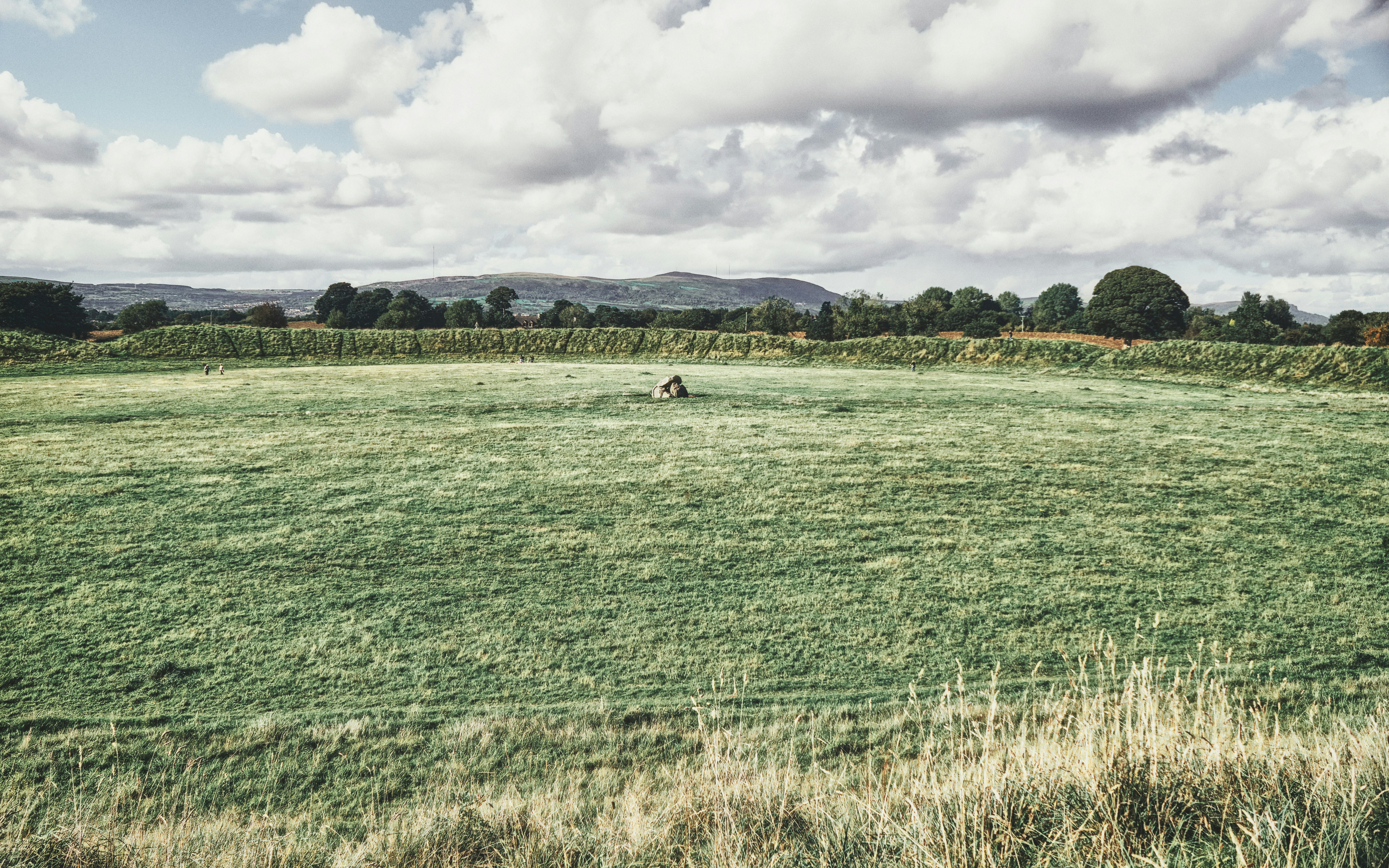 A wide view of the massive earthworks and the megalithic dolmen at the Giant's Ring--an ancient Neolithic portal tomb (2700 BCE) in County Antrim (Sep., 2021). You can read more about the Giant's Ring here: https://www.belfastentries.com/places/places-to-see/the-giants-ring/