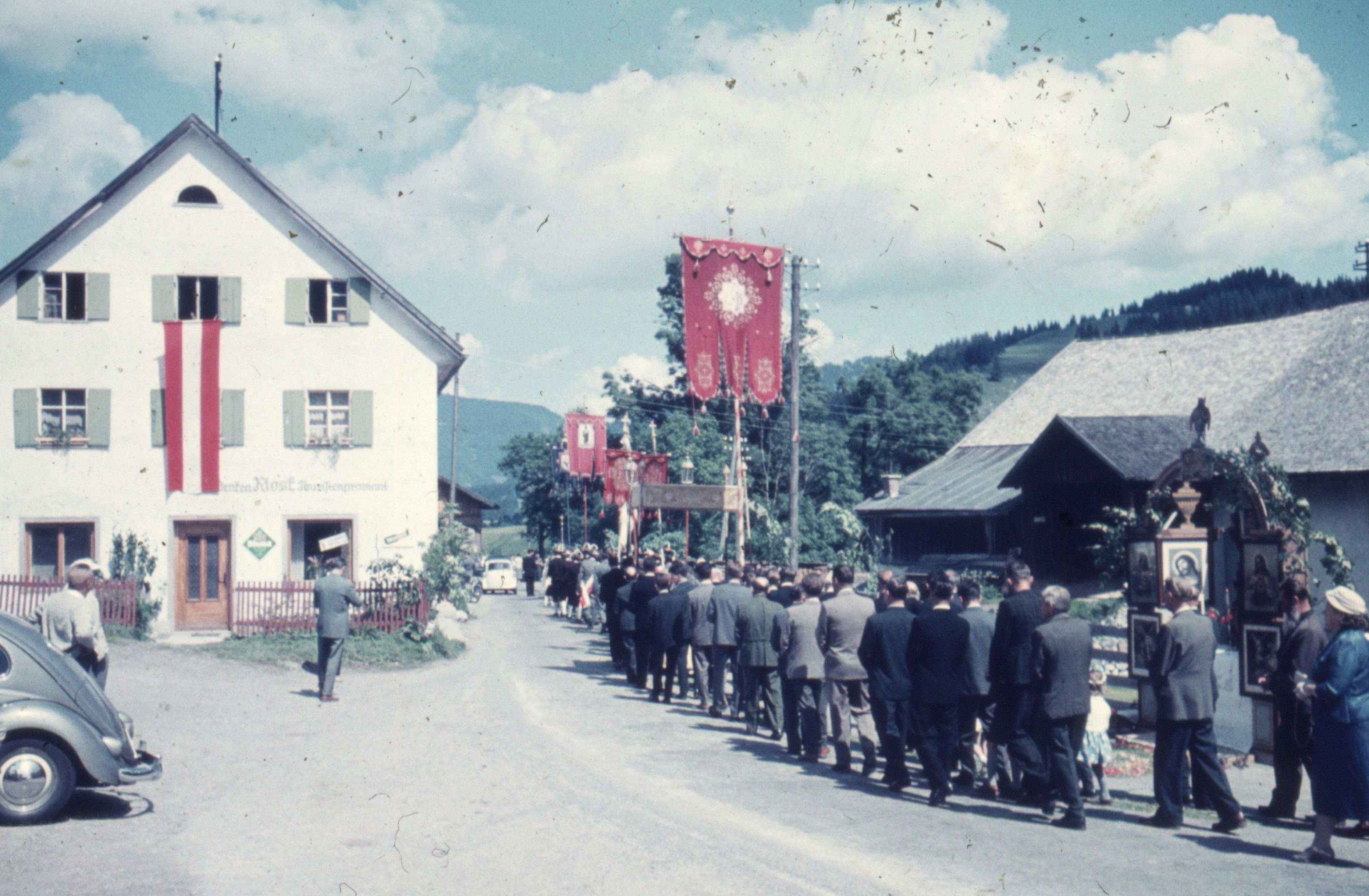 a group of people walking in front of a building
