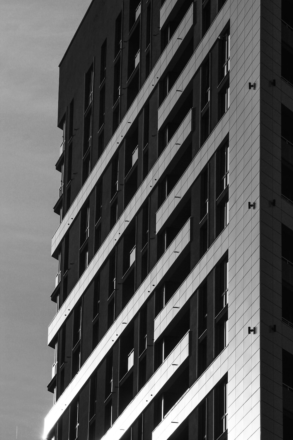 a black and white photo of a tall building