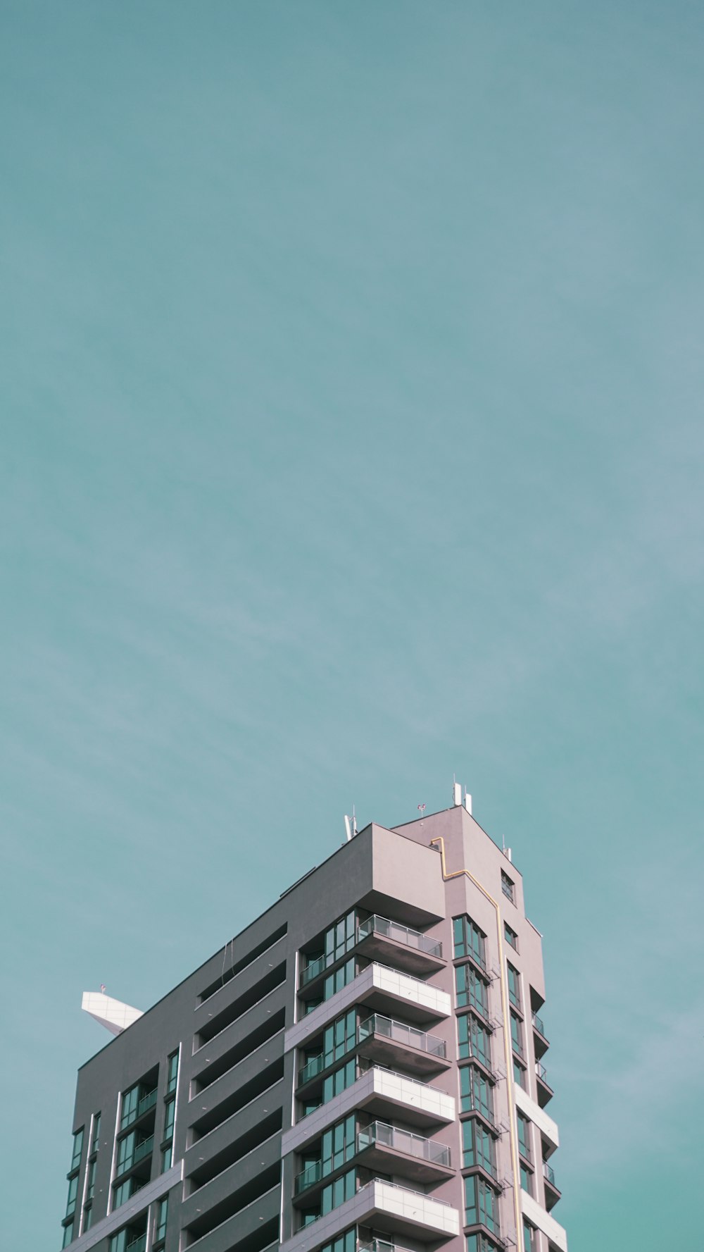 a tall building with a sky background