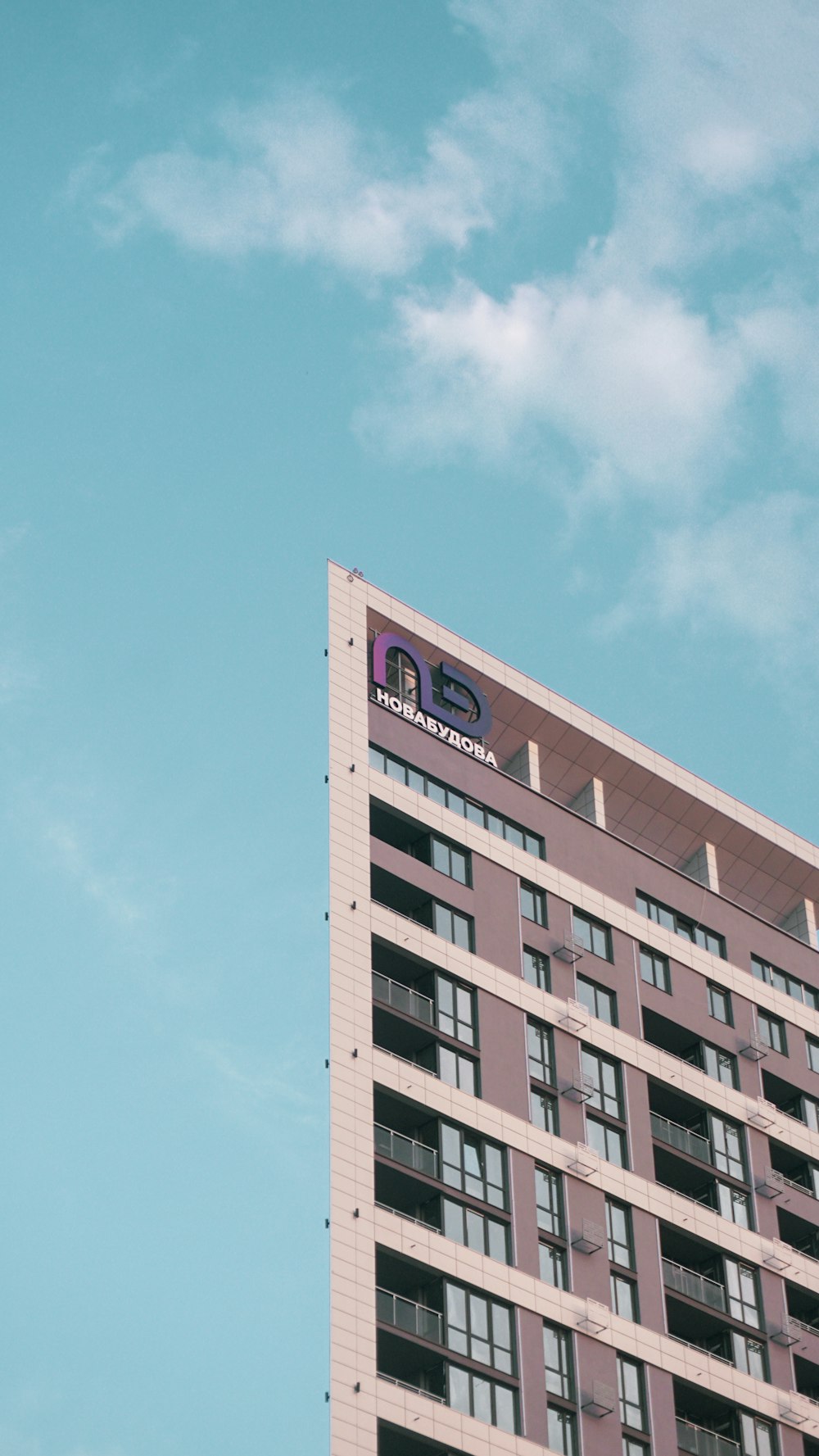 a tall building with a sky background