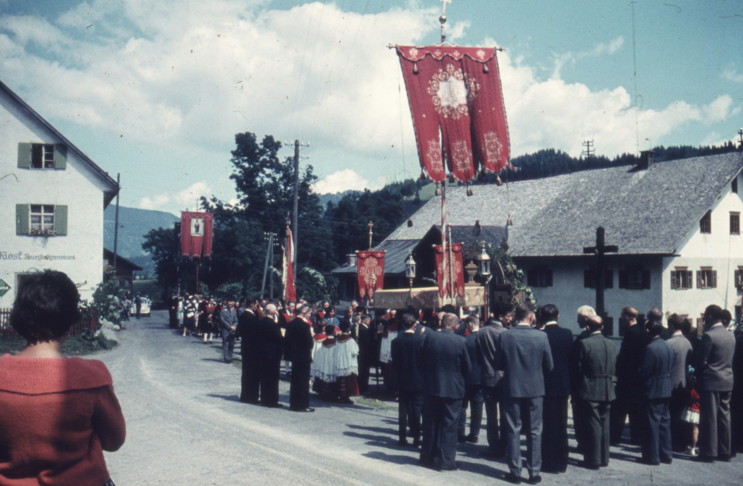 a group of people standing in front of a building