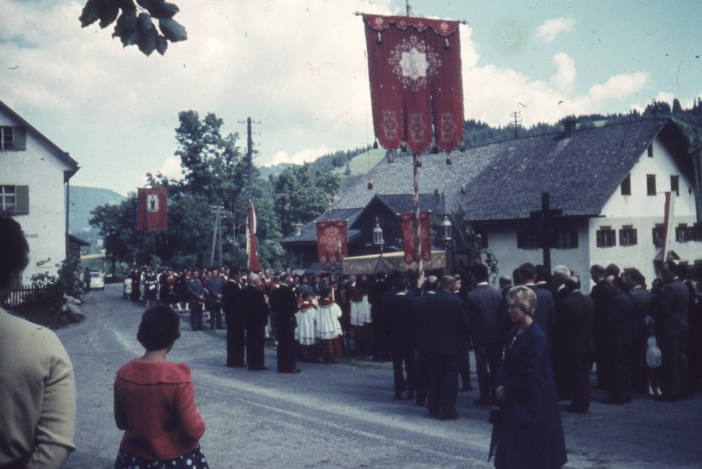 a group of people walking down a street