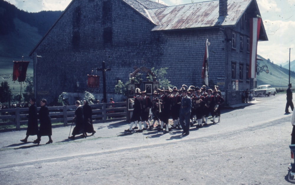 a group of people standing in front of a building