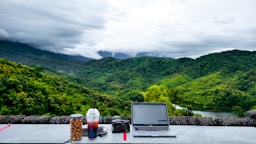 a laptop computer sitting on top of a table