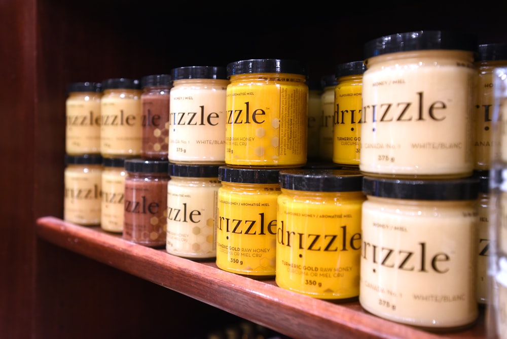 a shelf filled with lots of jars of food