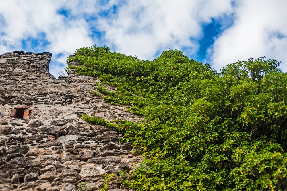 a stone tower with a small window on the side of it